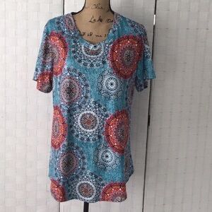 Woman’s top size 16 W color green, red yellow pretty design. Washable  NWOT